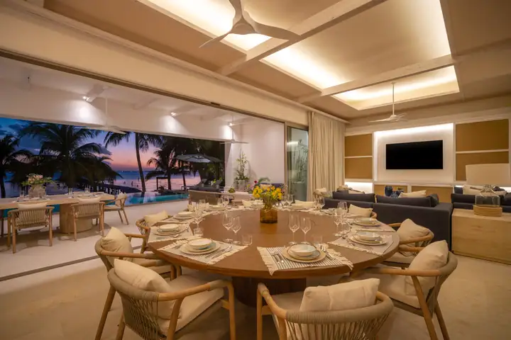 The Casa Azul dining room at sunset, glass doors open to the terrace