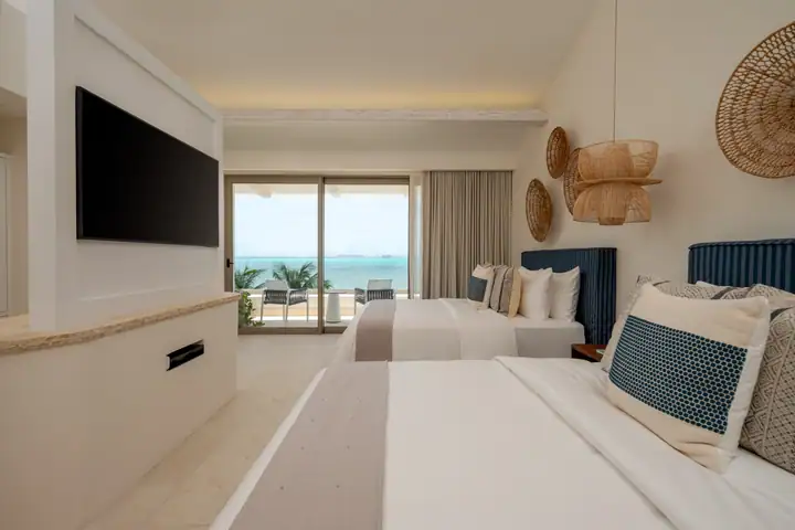 Double Room 2 at Casa Azul with two queen beds and a view of the sea