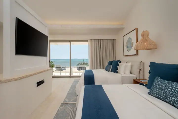 Double Room 3 at Casa Azul facing its balcony and the sea