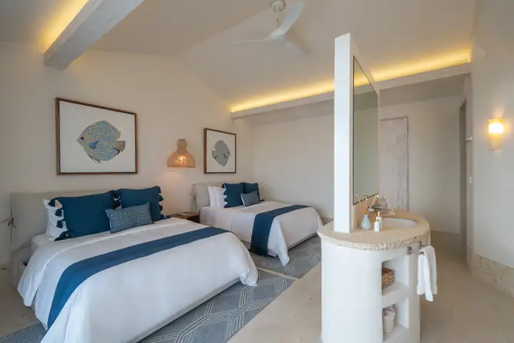 Double Room 3 at Casa Azul with two queen beds in navy and white