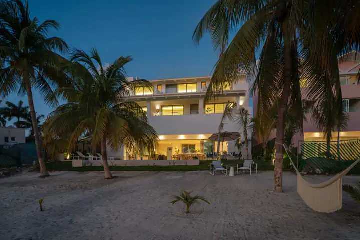 Casa Azul lit in the evening, seen from the beach