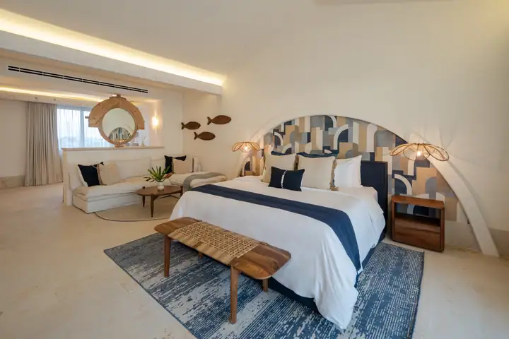 Master Suite 1 at Casa Azul with its arched headboard and navy linen