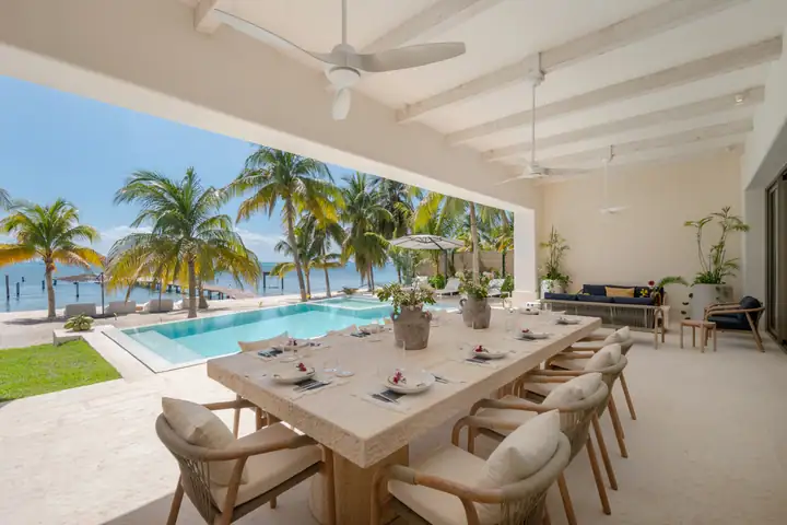 The terrace dining table at Casa Azul facing the pool and the sea