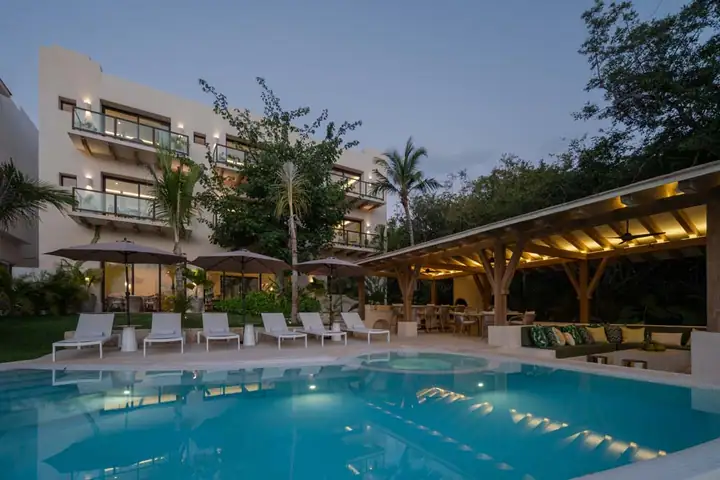 Blue hour over the pool and terrace at Casa Ceiba