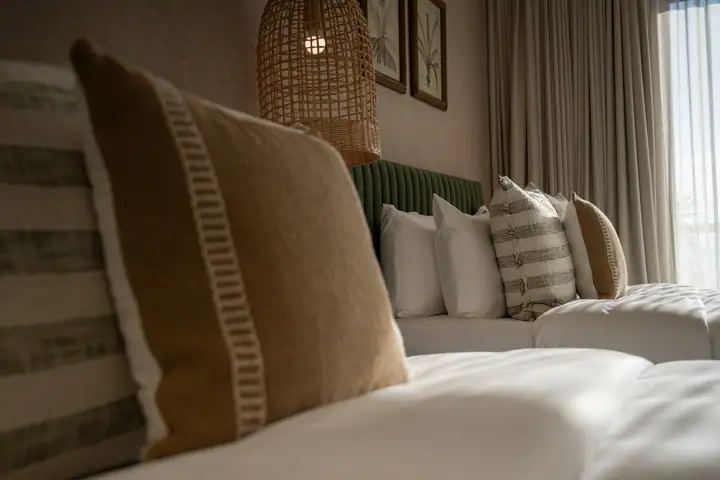 Double Room 3 at Casa Ceiba with jungle wallpaper and two queen beds