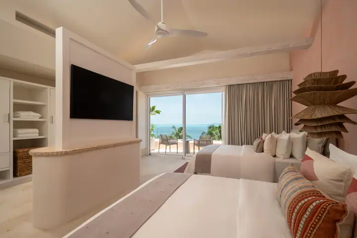 Double Room 2 at Casa Coral with two queen beds facing the sea