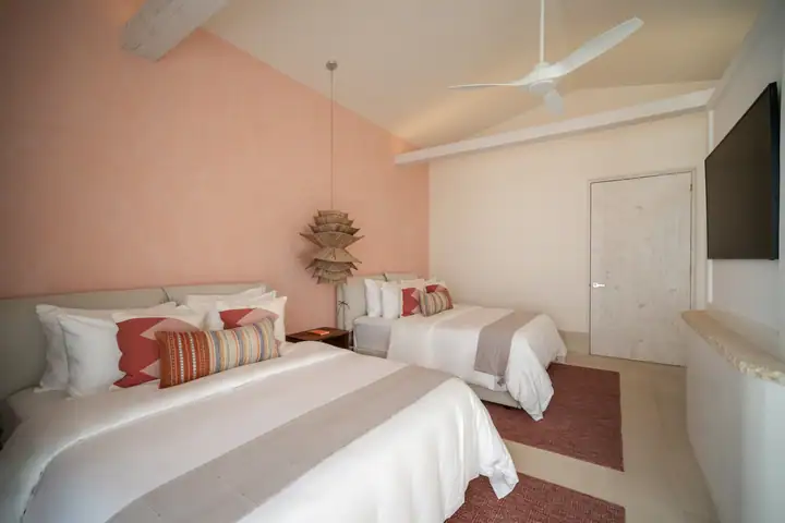 Double Room 2 at Casa Coral, two queen beds in coral and white