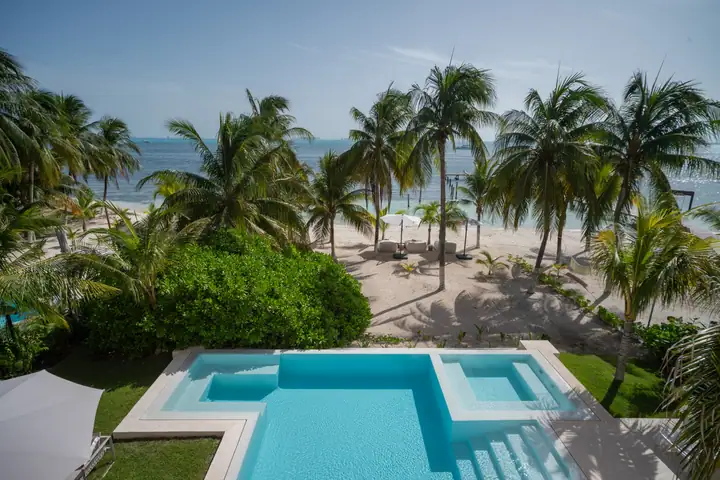 The jacuzzi at Casa Coral, the beach and palms beyond