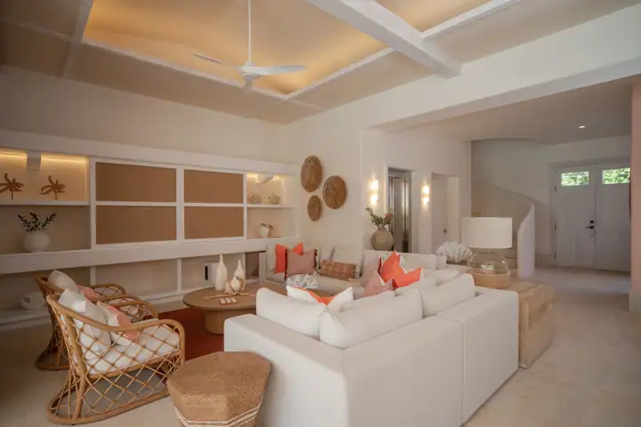 The Casa Coral living room and bar with rattan armchairs