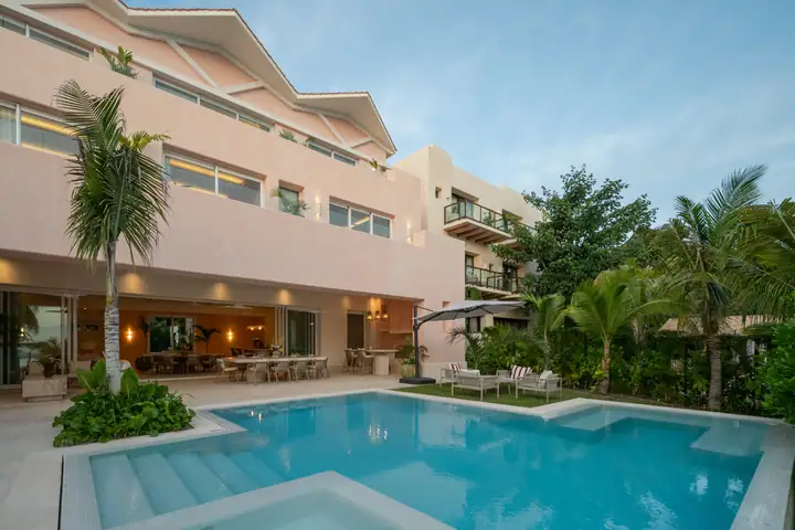 The pool and covered terrace at Casa Coral in the evening light