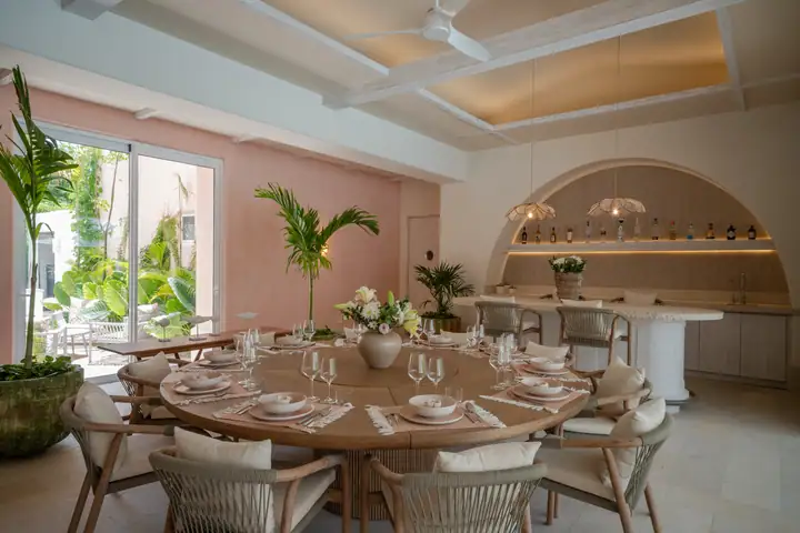 The round dining table at Casa Coral set for dinner